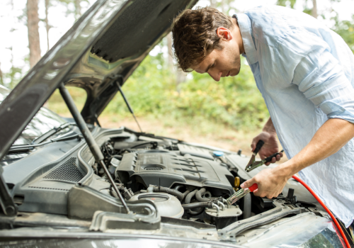 Man connecting jumper cables