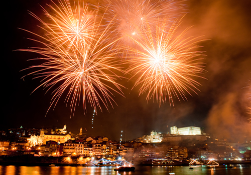 Fireworks at night in Porto over the Douro river